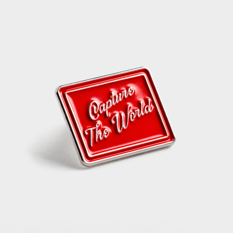 Capture the World Enamel Pin